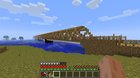 its not very fancy but I started playing 1.0 and made a castle and bridge with some other stuff